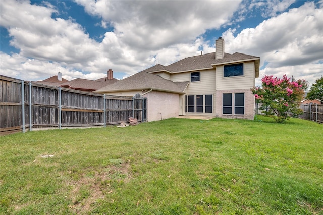 1403 Bosher Dr, Cedar Hill, TX 75104 - back of property with brick siding, a fenced backyard, a chimney, and a shingled roof