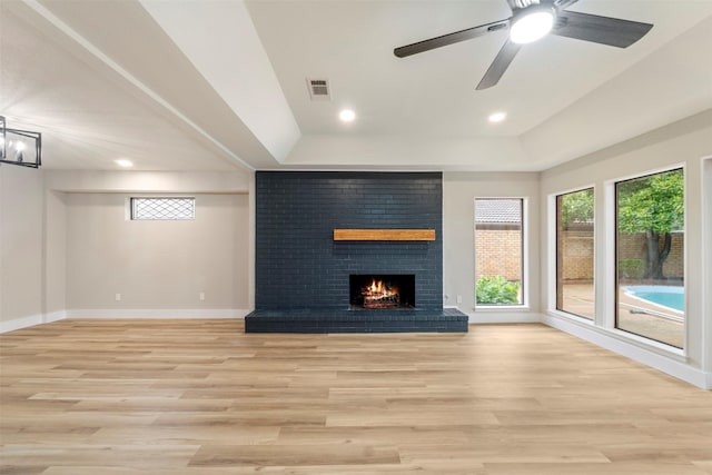 809 Havenwood Ln S, Fort Worth, TX 76112 - unfurnished living room with light wood finished floors, plenty of natural light, a tray ceiling, and recessed lighting
