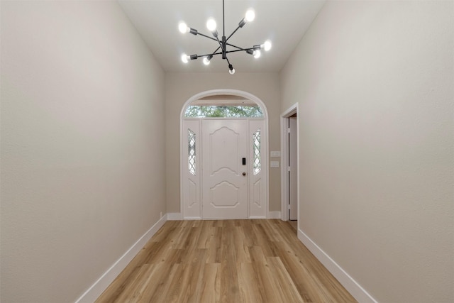 809 Havenwood Ln S, Fort Worth, TX 76112 - foyer entrance featuring a chandelier and light wood-type flooring