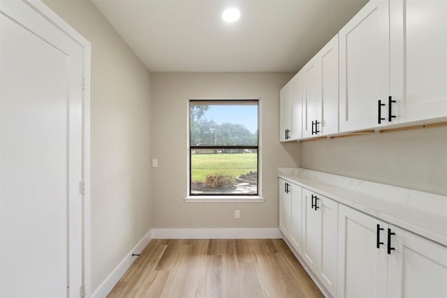 809 Havenwood Ln S, Fort Worth, TX 76112 - laundry area featuring light wood-type flooring and baseboards
