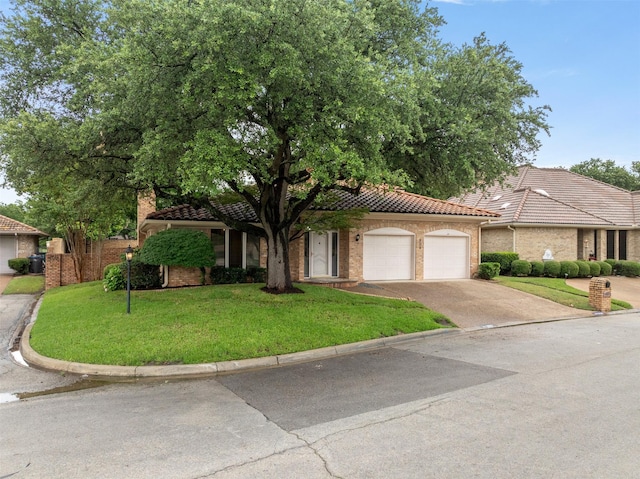 809 Havenwood Ln S, Fort Worth, TX 76112 - view of front of property with a tiled roof, a garage, driveway, and a front yard