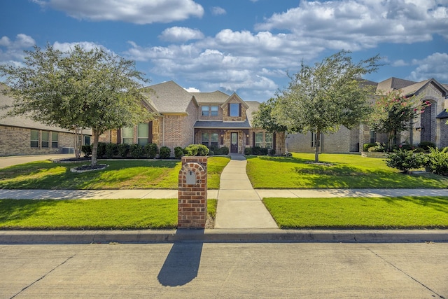 6913 Chisholm Trl, North Richland Hills, TX 76182 - view of front of home featuring a front yard and brick siding