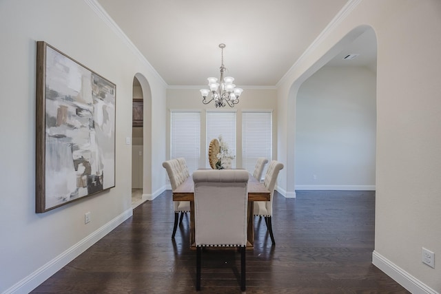 6913 Chisholm Trl, North Richland Hills, TX 76182 - dining room with arched walkways, crown molding, a chandelier, and dark wood-style flooring