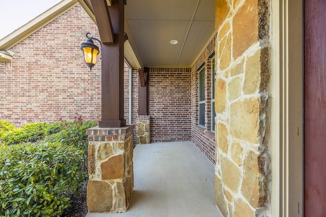 6913 Chisholm Trl, North Richland Hills, TX 76182 - doorway to property with brick siding and a porch