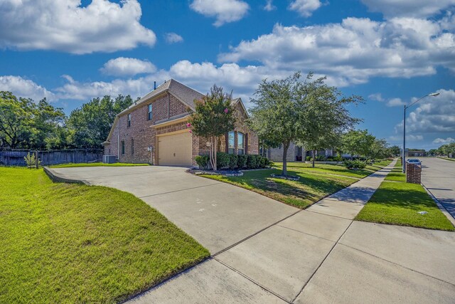 6913 Chisholm Trl, North Richland Hills, TX 76182 - view of front of property with brick siding, concrete driveway, and a garage