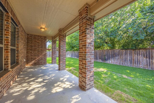 6913 Chisholm Trl, North Richland Hills, TX 76182 - fenced backyard featuring a patio