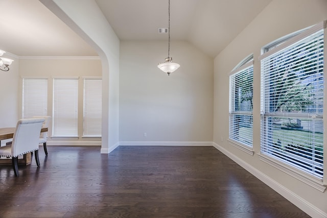 6913 Chisholm Trl, North Richland Hills, TX 76182 - unfurnished dining area with lofted ceiling, dark wood-type flooring, arched walkways, and a chandelier