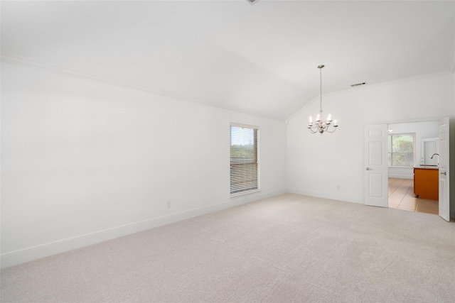 3217 Hidden Springs Dr, Corinth, TX 76210 - spare room featuring a chandelier, light carpet, ornamental molding, and lofted ceiling