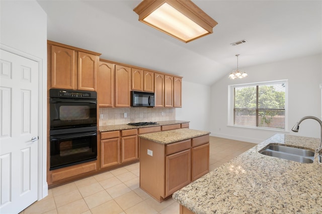 3217 Hidden Springs Dr, Corinth, TX 76210 - kitchen featuring black appliances, lofted ceiling, a center island, a chandelier, and backsplash