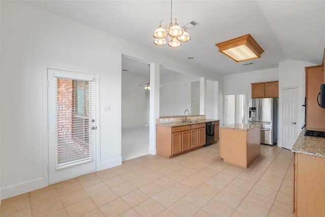 3217 Hidden Springs Dr, Corinth, TX 76210 - kitchen with black appliances, a chandelier, light stone counters, decorative light fixtures, and a center island