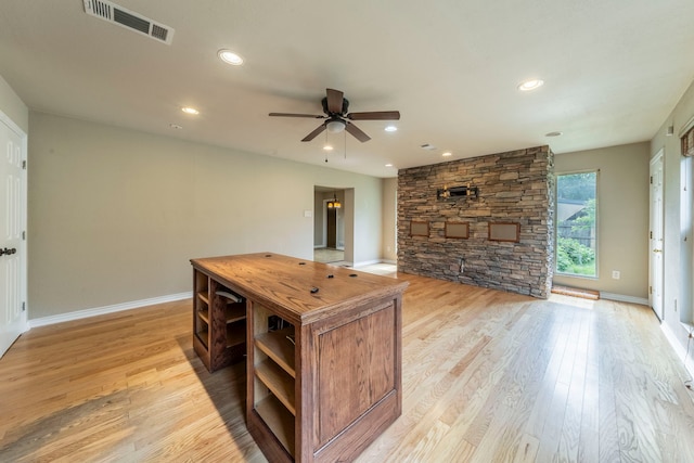 1022 Kings Row, Denton, TX 76209 - unfurnished living room featuring light wood-style flooring, a ceiling fan, and recessed lighting