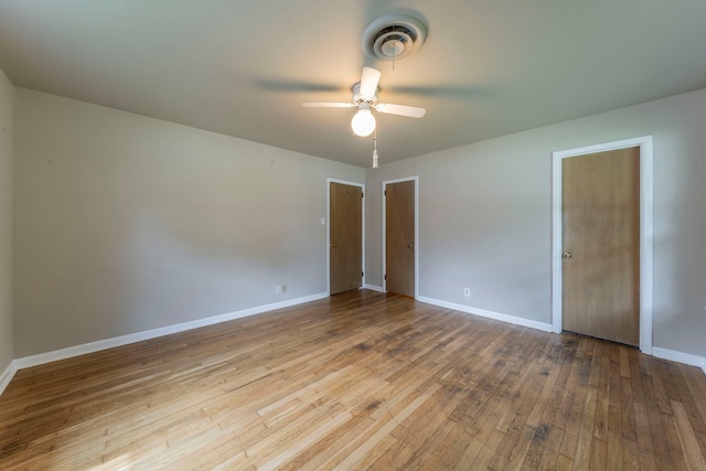 1022 Kings Row, Denton, TX 76209 - unfurnished bedroom with hardwood / wood-style flooring and a ceiling fan