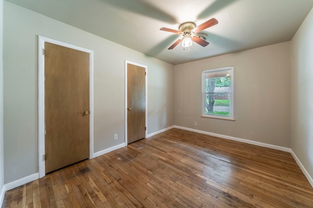 1022 Kings Row, Denton, TX 76209 - unfurnished bedroom with hardwood / wood-style floors and a ceiling fan