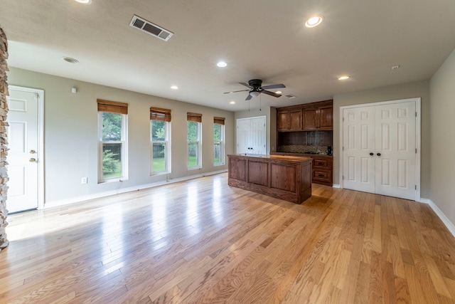 1022 Kings Row, Denton, TX 76209 - unfurnished living room featuring recessed lighting, ceiling fan, and light wood finished floors