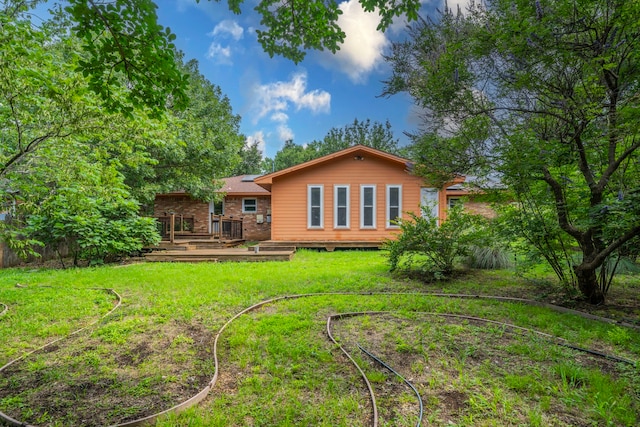 1022 Kings Row, Denton, TX 76209 - back of property with a deck and a yard