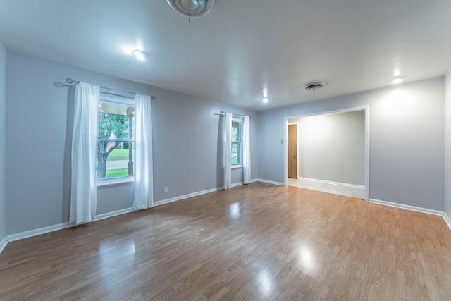 1022 Kings Row, Denton, TX 76209 - unfurnished room with wood finished floors and baseboards