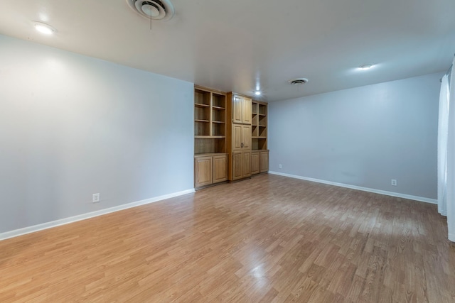 1022 Kings Row, Denton, TX 76209 - unfurnished room featuring light wood-style flooring and built in features