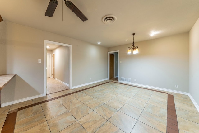 1022 Kings Row, Denton, TX 76209 - empty room featuring inlaid floor details, ceiling fan, recessed lighting, light tile patterned floors, and a chandelier