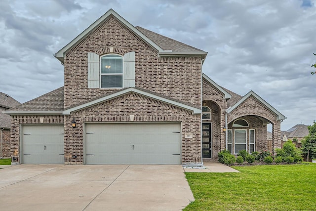 140 Godstone Ln, Prosper, TX 75078 - french country inspired facade featuring brick siding, a shingled roof, concrete driveway, and a front yard