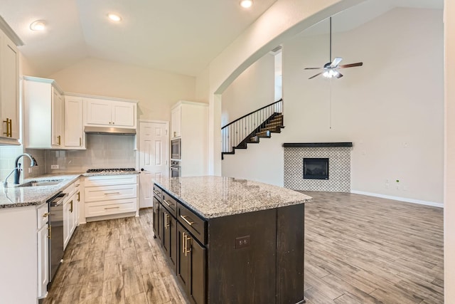 140 Godstone Ln, Prosper, TX 75078 - kitchen featuring vaulted ceiling, ceiling fan, white cabinetry, light wood-type flooring, and stainless steel appliances