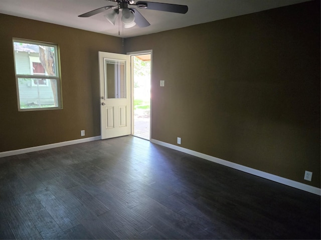 818 N Commerce St, Gainesville, TX 76240 - empty room featuring a ceiling fan and dark wood-style floors