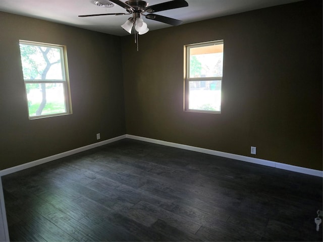 818 N Commerce St, Gainesville, TX 76240 - empty room with ceiling fan and dark wood-style floors