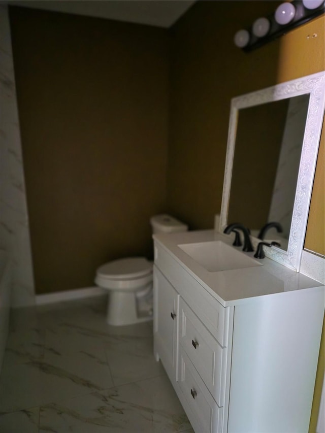 818 N Commerce St, Gainesville, TX 76240 - half bath featuring vanity and marble finish floors