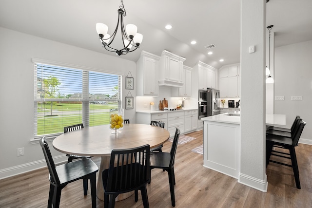 458 Red Maple Rd, Waxahachie, TX 75165 - dining room with light wood-type flooring, a chandelier, lofted ceiling, and recessed lighting