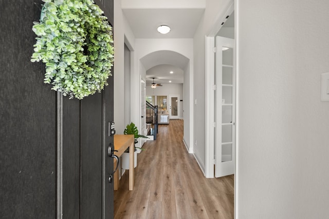 458 Red Maple Rd, Waxahachie, TX 75165 - foyer entrance featuring wood finished floors, arched walkways, and a ceiling fan