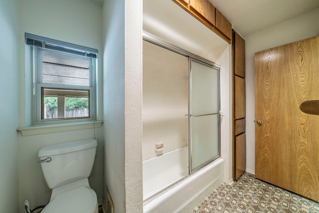 4524 Coyote Pt, Denton, TX 76208 - full bathroom featuring bath / shower combo with glass door and a textured ceiling