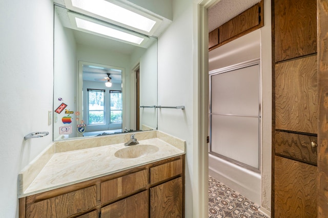 4524 Coyote Pt, Denton, TX 76208 - bathroom featuring vanity and bath / shower combo with glass door