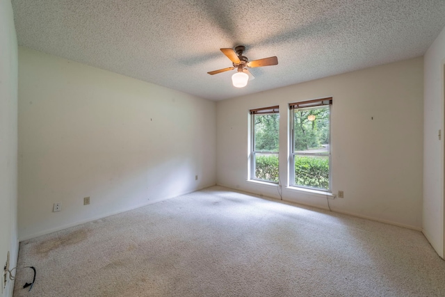 4524 Coyote Pt, Denton, TX 76208 - carpeted spare room featuring a ceiling fan and a textured ceiling