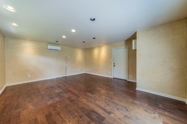 4524 Coyote Pt, Denton, TX 76208 - empty room with wood finished floors, an AC wall unit, and recessed lighting