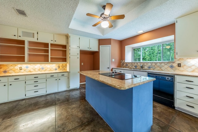 4524 Coyote Pt, Denton, TX 76208 - kitchen with black appliances, tasteful backsplash, a textured ceiling, and a kitchen island