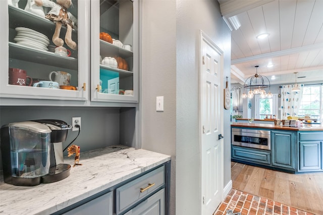 200 Stone Hollow Ct, Prosper, TX 75078 - bar with wooden ceiling, a chandelier, brick patterned floors, and pendant lighting