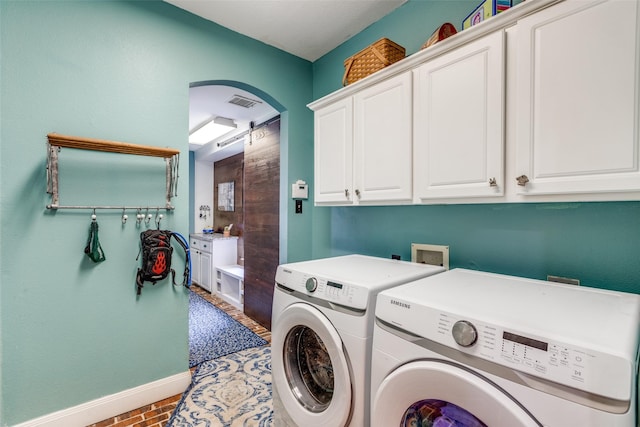 200 Stone Hollow Ct, Prosper, TX 75078 - washroom with cabinet space, washer and clothes dryer, and arched walkways