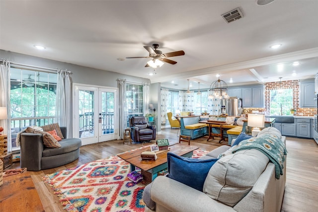 200 Stone Hollow Ct, Prosper, TX 75078 - living room with a ceiling fan, healthy amount of natural light, light wood finished floors, recessed lighting, and french doors
