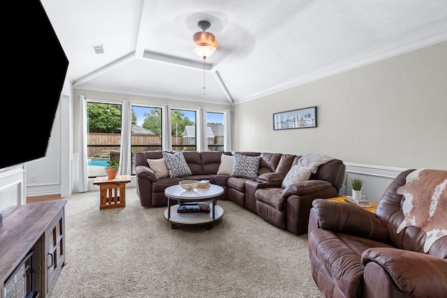 2301 Coleshire Dr, Plano, TX 75075 - carpeted living area featuring lofted ceiling, crown molding, and wainscoting