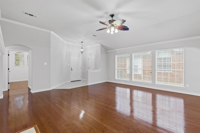 8128 Hosta Way, Fort Worth, TX 76123 - unfurnished living room with ceiling fan, hardwood / wood-style flooring, arched walkways, and ornamental molding