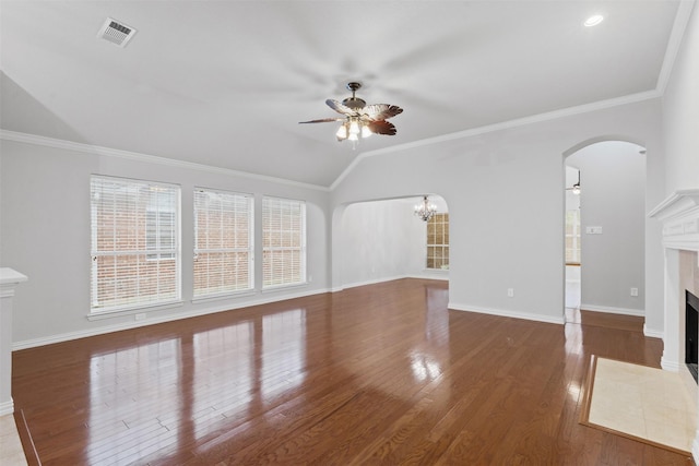 8128 Hosta Way, Fort Worth, TX 76123 - unfurnished living room with a ceiling fan, arched walkways, a fireplace with flush hearth, vaulted ceiling, and wood finished floors
