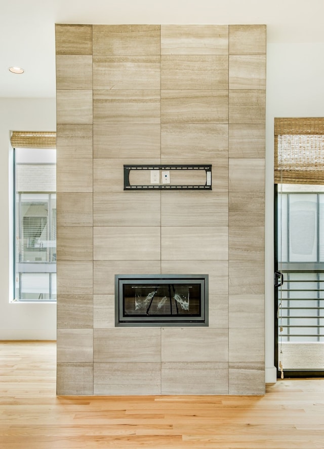 1847 Summit Ave Unit 2B, Dallas, TX 75206 - detailed view of wood finished floors, a fireplace, and recessed lighting