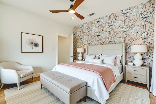 1847 Summit Ave Unit 2B, Dallas, TX 75206 - bedroom featuring wood finished floors, recessed lighting, ceiling fan, and an accent wall