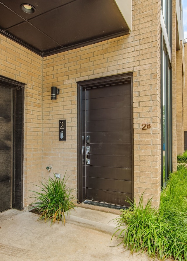 1847 Summit Ave Unit 2B, Dallas, TX 75206 - doorway to property with brick siding