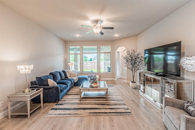 2150 Bristlegrass Rd, Frisco, TX 75033 - living room featuring arched walkways, ceiling fan, and wood finished floors