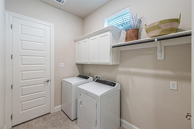 2150 Bristlegrass Rd, Frisco, TX 75033 - washroom with separate washer and dryer, cabinet space, and light tile patterned floors