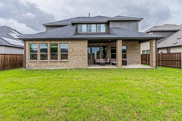 2150 Bristlegrass Rd, Frisco, TX 75033 - back of property with an outdoor living space, a patio area, a fenced backyard, and brick siding