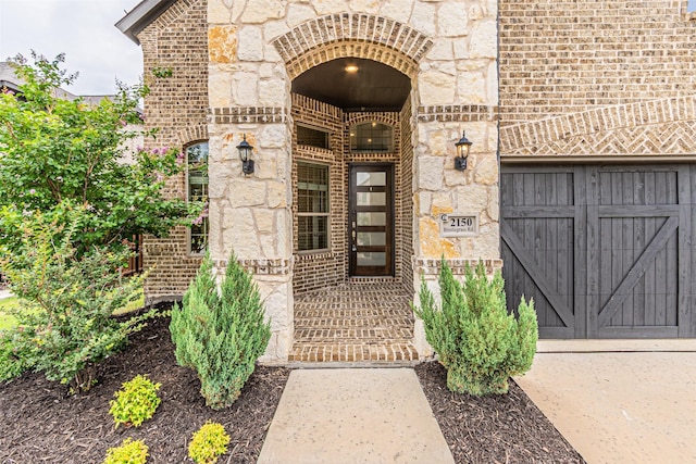 2150 Bristlegrass Rd, Frisco, TX 75033 - view of exterior entry featuring stone siding and brick siding