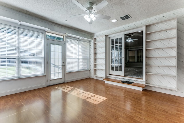 5008 Natchez Dr, Sachse, TX 75048 - unfurnished room featuring a textured ceiling, ceiling fan, and wood finished floors