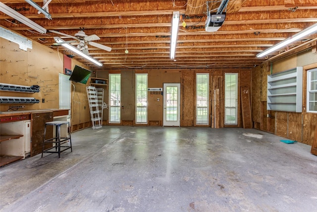 5008 Natchez Dr, Sachse, TX 75048 - garage featuring a garage door opener and ceiling fan