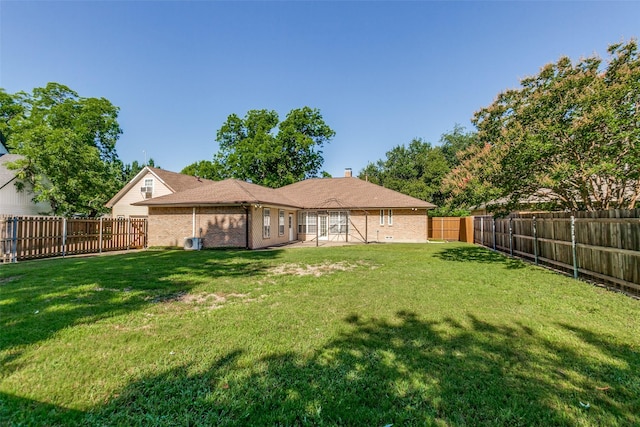 5008 Natchez Dr, Sachse, TX 75048 - rear view of house with a fenced backyard, brick siding, and a chimney